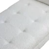 Banc recouvert de tissu blanc et pieds en bois noir