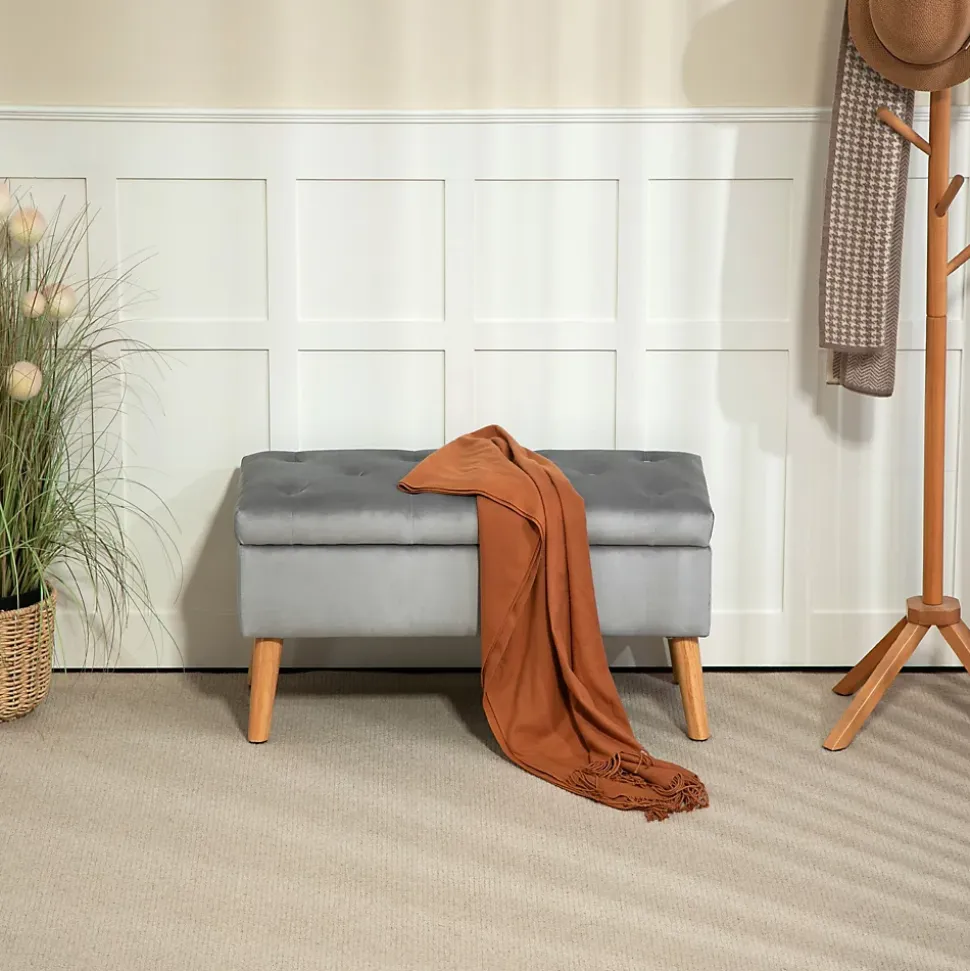 Banquette coffre design scandinave piètement effilé bois assise effet capitonné velours gris