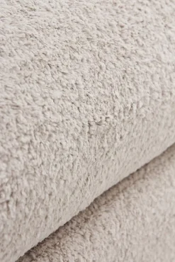 Banquette coffre tapissée en boucle grise avec structure et pieds en pin