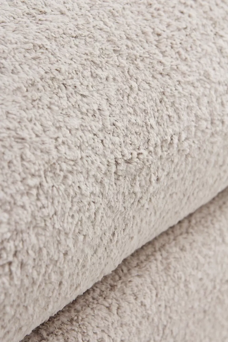 Banquette coffre tapissée en boucle grise avec structure et pieds en pin