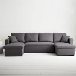 Canapé panoramique convertible en tissu gris foncé. 4 places. coffre rangement. lit modulable