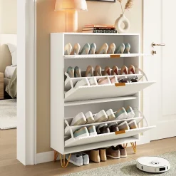 Meuble à chaussures 2 portes, design ondulé blanc, pieds hauts, espace extensible, surface imperméable et facile à nettoyer