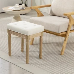 Tabouret repose-pied capitonné style classique bois sculpté patiné tissu toucher lin beige