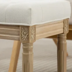 Tabouret repose-pied capitonné style classique bois sculpté patiné tissu toucher lin beige