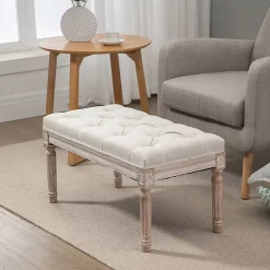 Tabouret repose-pied capitonné style classique - bois d'hévéa sculpté, patiné - revêtement aspect lin beige